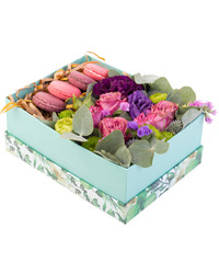 macarons with flowers in a box
